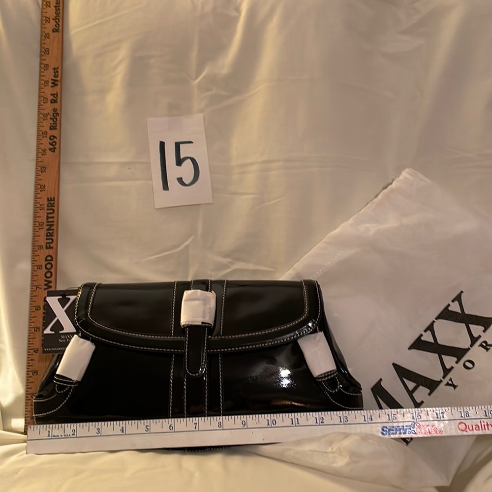 Black brand new MAXX NEW YORK purse. Never used no rips, tears or damage. 14 x 7